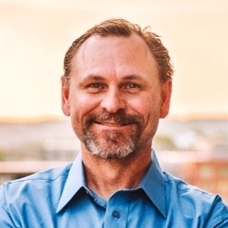 Smiling man in a blue shirt